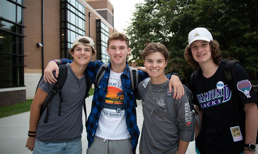 A group of students smiles